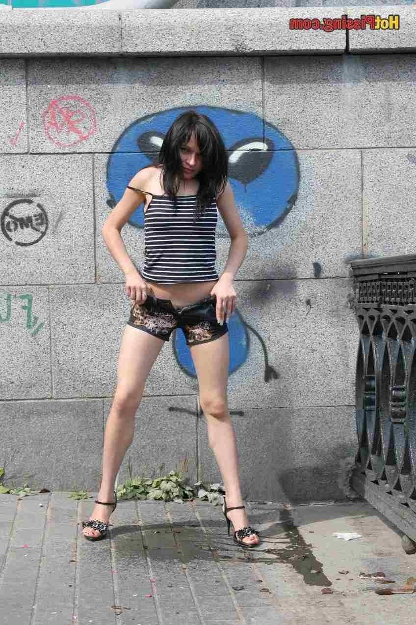 15P Slut pissing outdoors