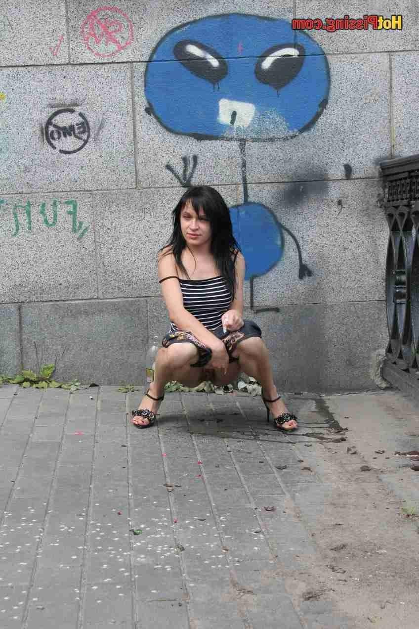15P Slut pissing outdoors