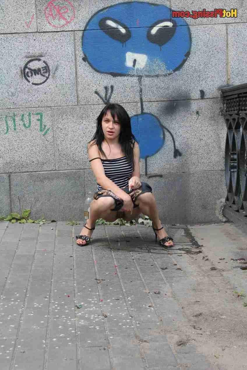 15P Slut pissing outdoors