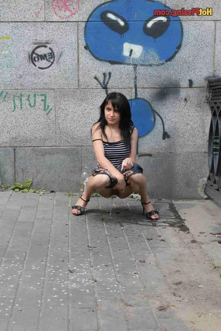 15P Slut pissing outdoors