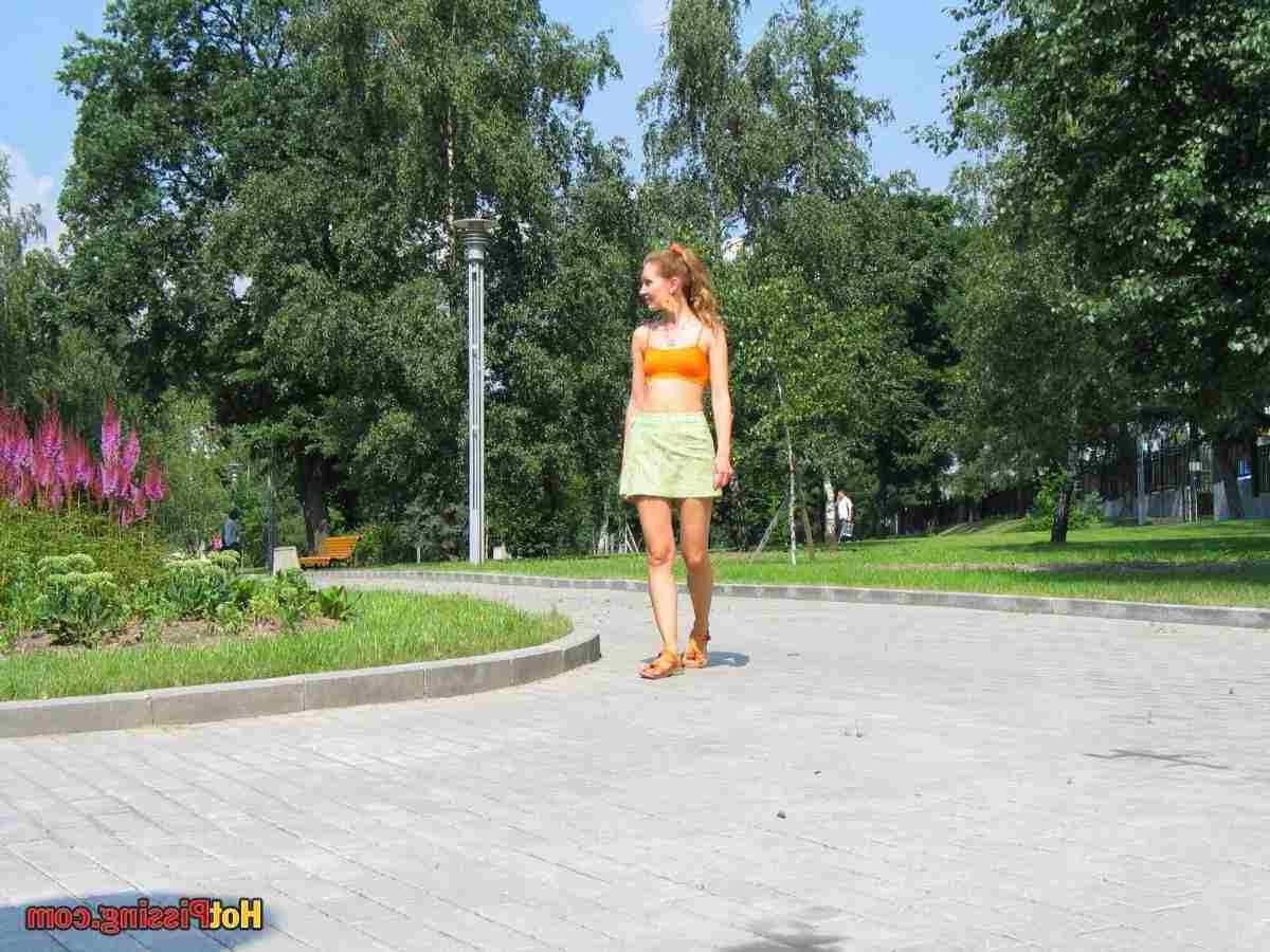 15P Slut pissing outdoors