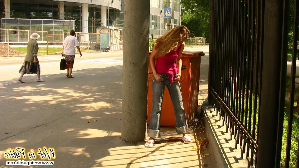 15P Slim slut in jeans pisses herself while having no toilet found