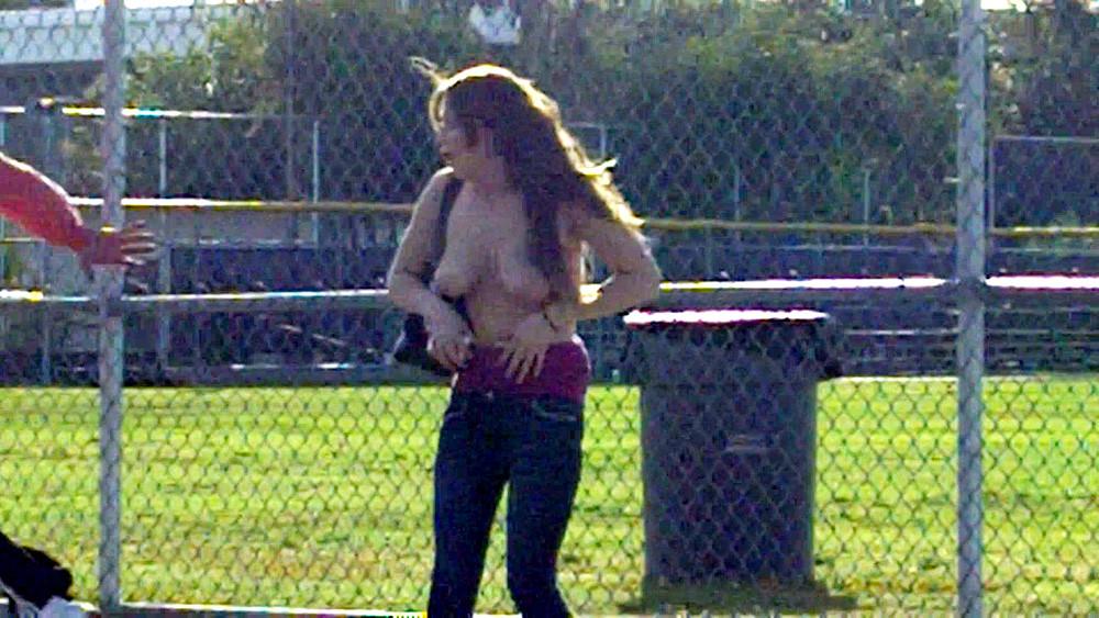 16P Hot brunettes big tits exposed at park