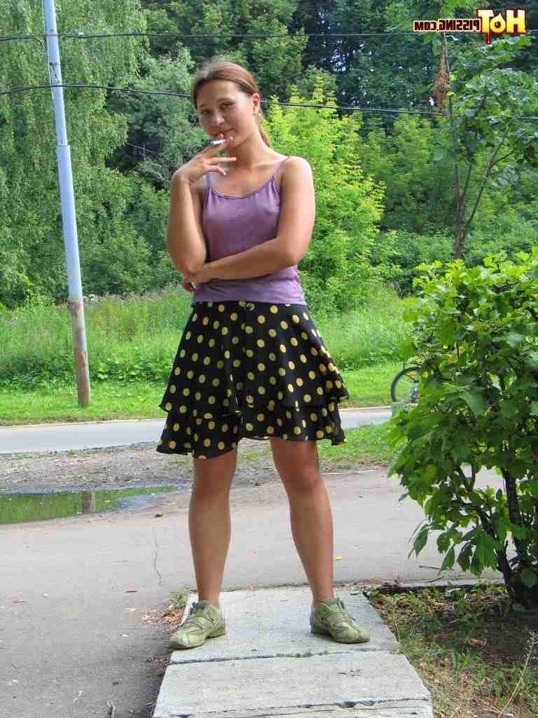 15P Slut pissing outdoors