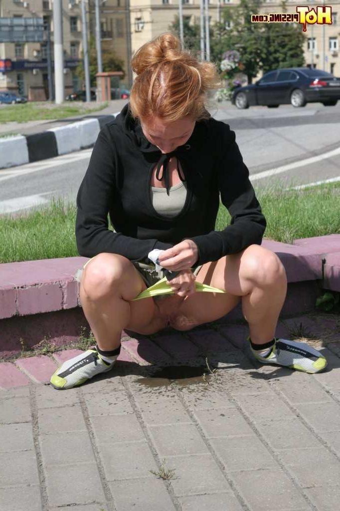 16P Girl pissing next to a street