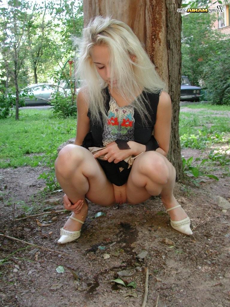 15P Pee-needed blonde squats behind a tree to relieve herself in the park