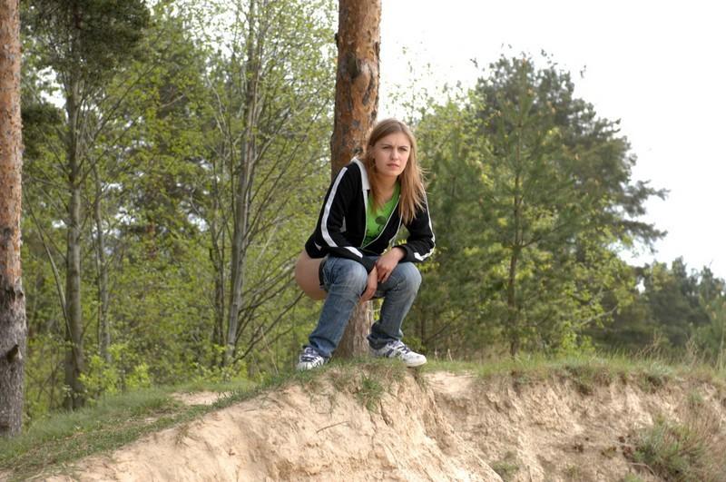 16P Girl takes off her pants and takes a piss outdoors