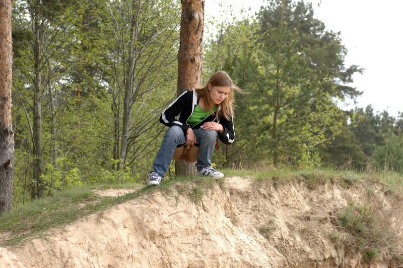 16P Girl takes off her pants and takes a piss outdoors