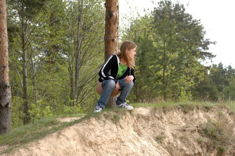 16P Girl takes off her pants and takes a piss outdoors