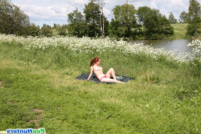16P Sunbathing amateur teen in thong takes a piss outdoors
