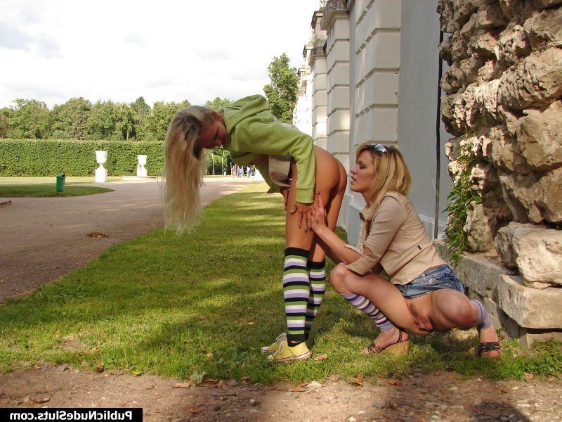 15P Naughty couple of hot lesbians enjoys showing off behind the building