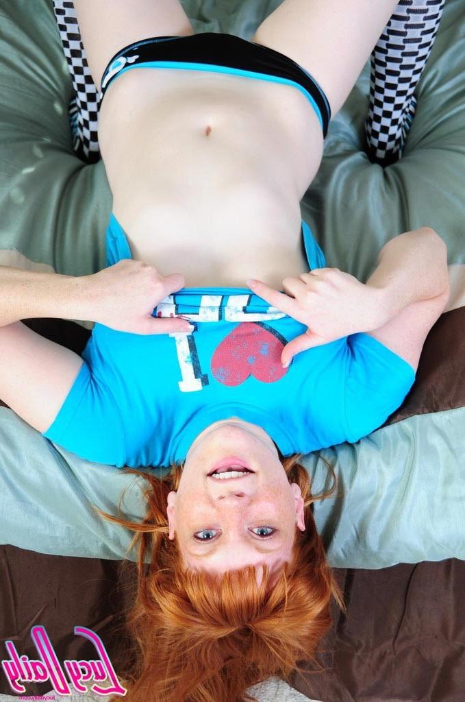 16P Pale redhead girl removes panties and socks