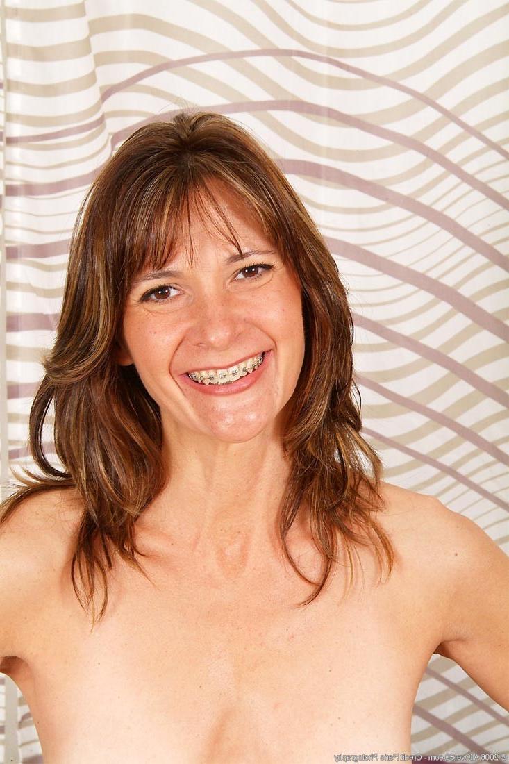 15P Tall and sexy milf stripping in the bedroom