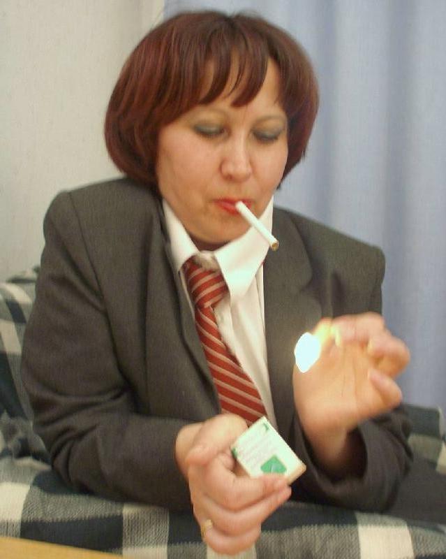 20P Big tit brunette milf strip teasing on a couch