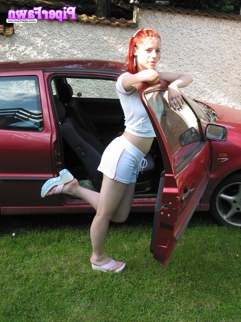 16P Busty redhead teen outside showing her car