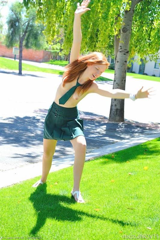 15P Fresh redhead teen dressed as schoolgirl in the park