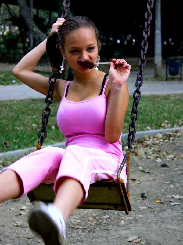 12P Cute Paris Milan playing outdoors on a playground