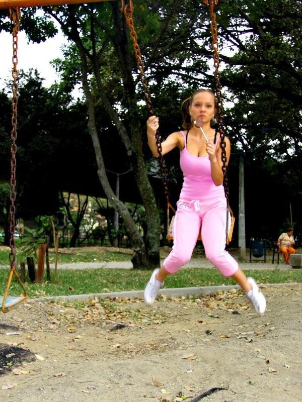 12P Cute Paris Milan playing outdoors on a playground