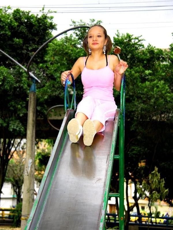 12P Cute Paris Milan playing outdoors on a playground
