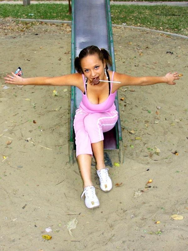 12P Cute Paris Milan playing outdoors on a playground