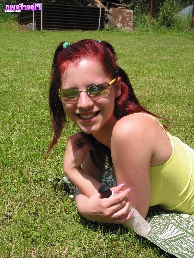 16P Busty redhead teen wearing sunglasses outdoors