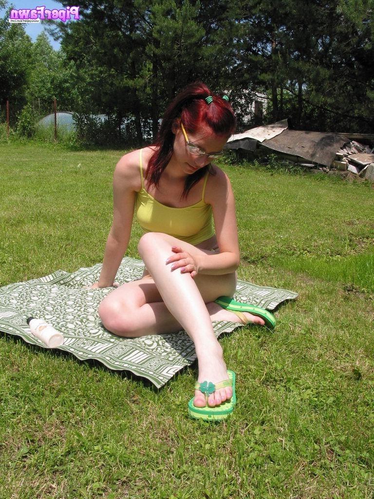 16P Busty redhead teen wearing sunglasses outdoors