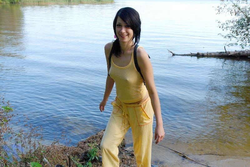 20P Petite brunette babe in park and strips naked