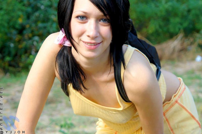 20P Petite brunette babe in park and strips naked