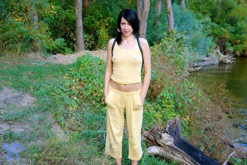 20P Petite brunette babe in park and strips naked