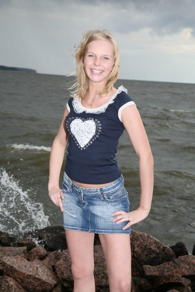 15P Tiny teen pulls aside panties to spread by sea