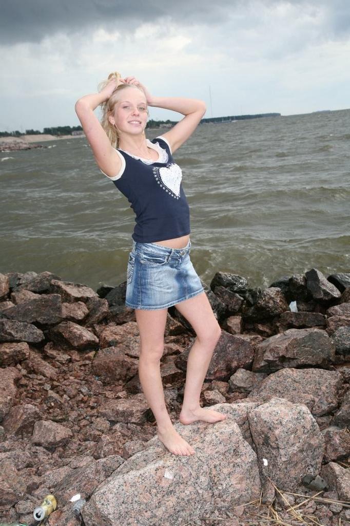 15P Tiny teen pulls aside panties to spread by sea