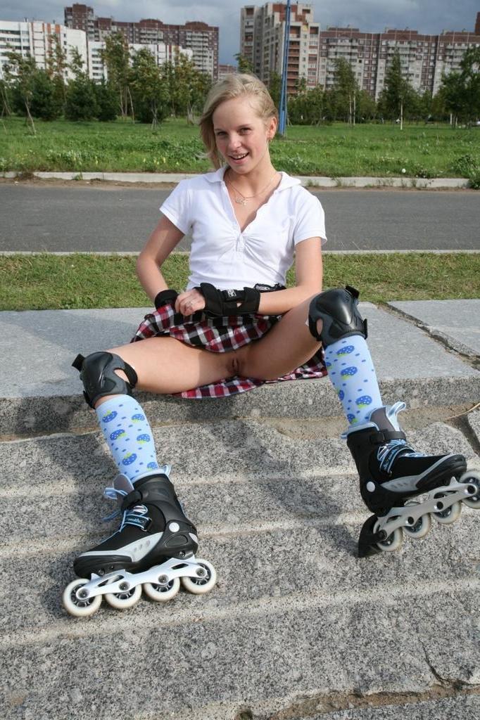 15P Teen spreads pussy in the park on rollerblades