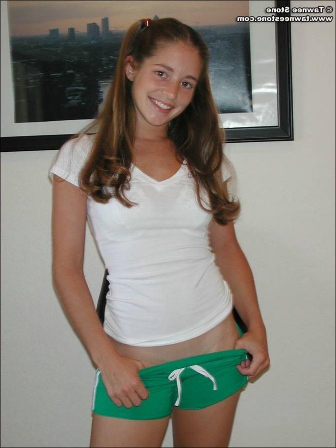 15P Young brunette takes off her panties and spreads her legs