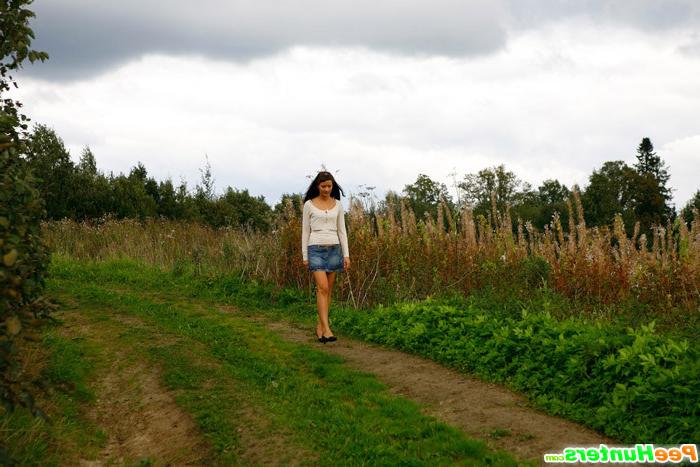16P Babe tinkles on a road in the middle of a field