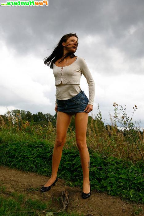 16P Babe tinkles on a road in the middle of a field