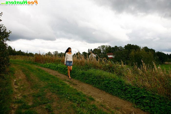 16P Babe tinkles on a road in the middle of a field