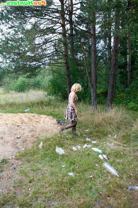 16P Blonde girl takes a leak in the middle of a field