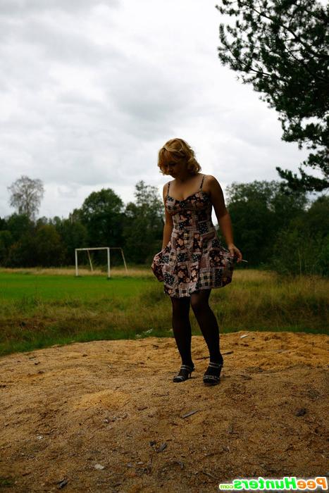 16P Blonde girl takes a leak in the middle of a field