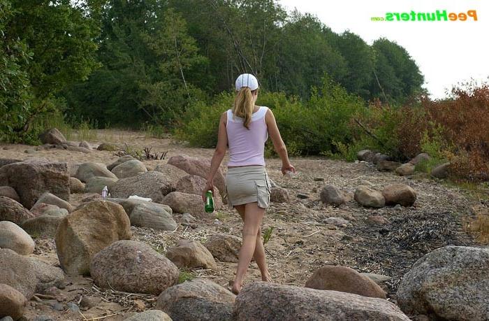 16P Hot teen smoker piddling off the rock in the park