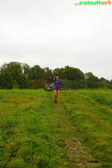 16P Girl pulls the hem of her dress up to pee outdoors
