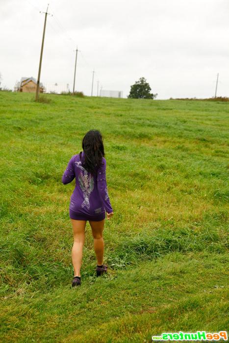 16P Girl pulls the hem of her dress up to pee outdoors