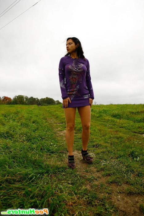16P Girl pulls the hem of her dress up to pee outdoors