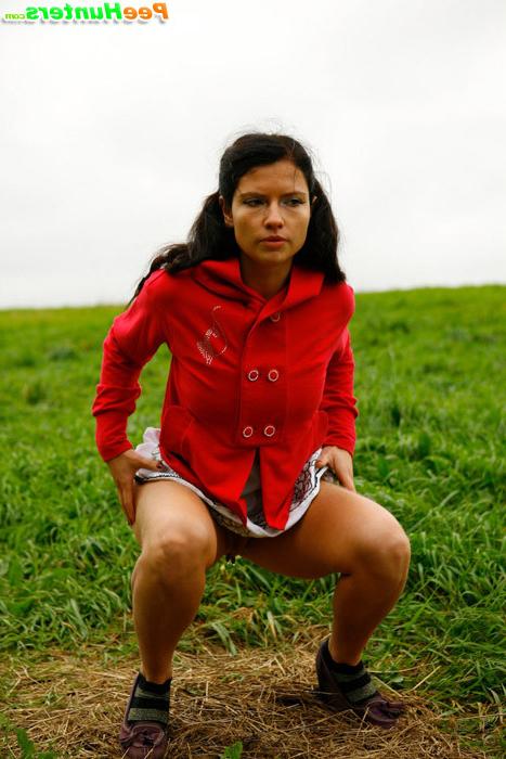 16P Girlie feeling cold takes a quick leak on a field