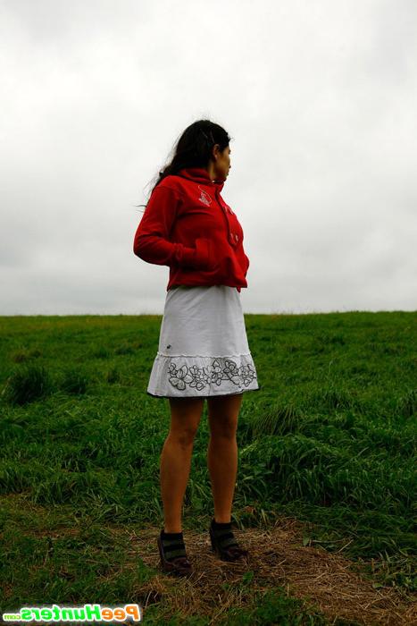 16P Girlie feeling cold takes a quick leak on a field