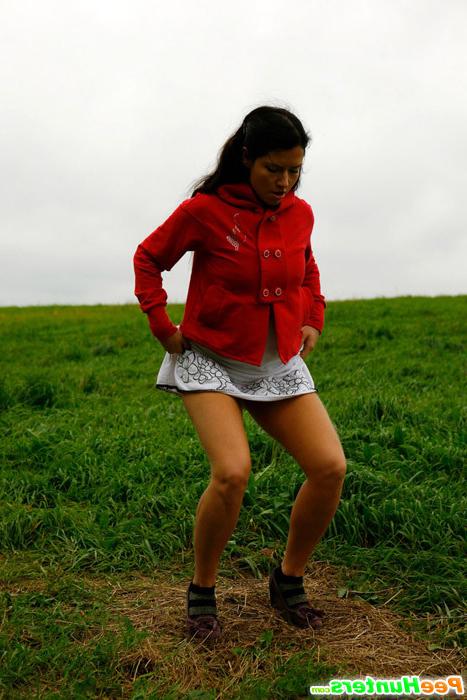 16P Girlie feeling cold takes a quick leak on a field