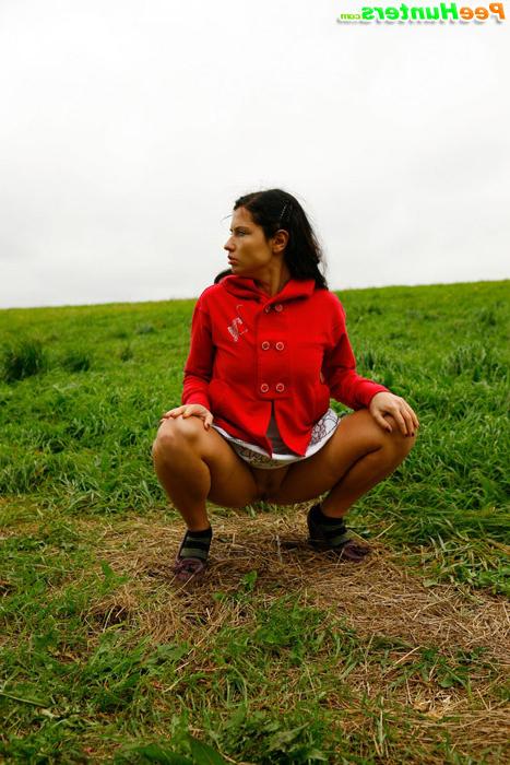 16P Girlie feeling cold takes a quick leak on a field