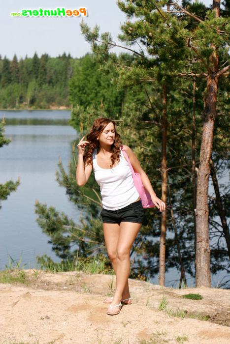 16P Cute redhead with big booty takes a leak outdoors