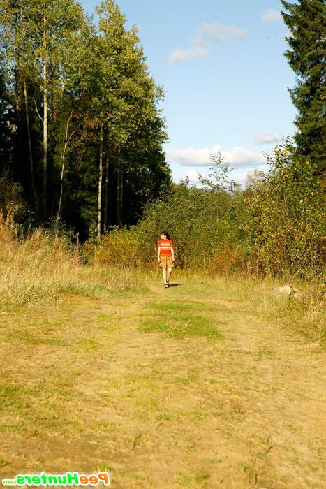 5P Cute tart walking down the hill squats down to pee