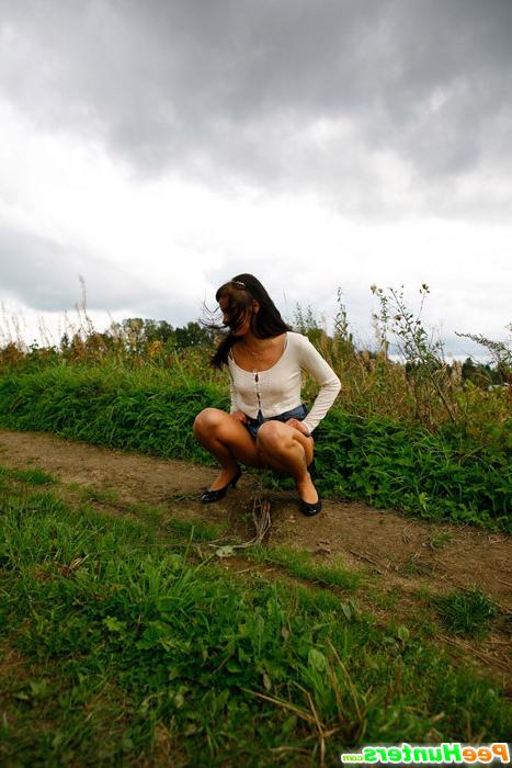 16P Cute brunette babe pisses up a storm in the field