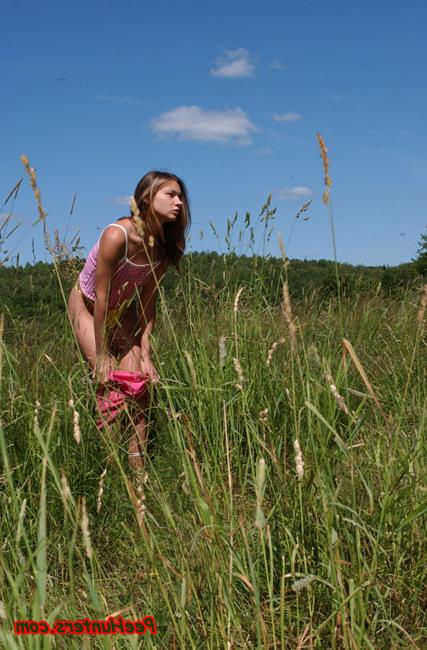 16P Beautiful teen peeing on the field